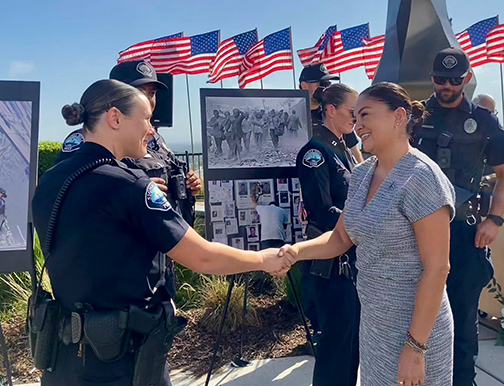 Senator Gonzalez shaking hands with a policewoman
